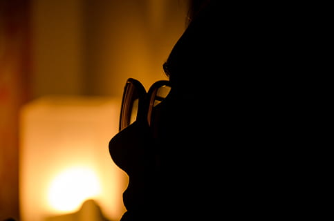 lightning, light, lighter, lighthouse, one person, silhouette, close-up, indoors, orange color, sunset, real people, focus on foreground, holding, technology, human body part, men, copy space, hand, eyeglasses, human hand, leisure activity, glasses, adult, dark, 4K, CC0, public domain, royalty free