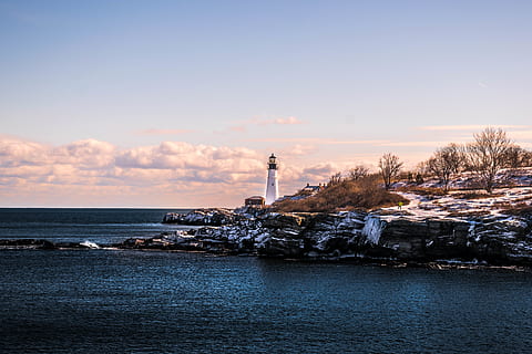white, lighthouse, cloudy, day, beach, clouds, coast, daytime, ocean, rocks, scenic, sea, seascape, sky, snow, water, built structure, architecture, building exterior, guidance, tower, building, nature, scenics - nature, beauty in nature, no people, waterfront, protection, cloud - sky, direction, security, outdoors, 5K, CC0, public domain, royalty free