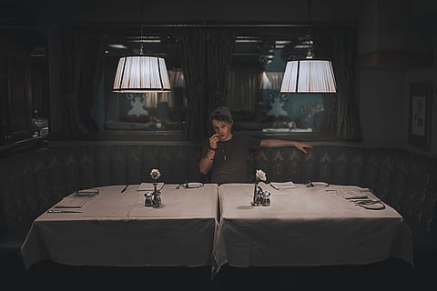man in restaurant, people, man, one person, real people, indoors, lighting equipment, front view, lifestyles, illuminated, women, table, leisure activity, sitting, females, adult, portrait, casual clothing, electric lamp, communication, business, holding, 4K, CC0, public domain, royalty free
