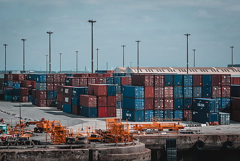 intermodal, container, stacked, port, cargo, cargo container, clouds, commerce, containers, harbor, industry, pier, shipment, sky, warehouse, freight transportation, business, architecture, commercial dock, stack, transportation, shipping, water, nature, no people, machinery, day, built structure, domestic room, outdoors, 2K