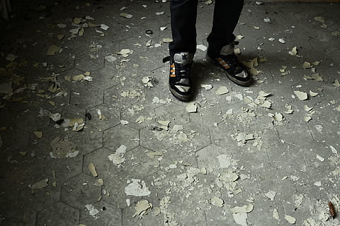 person, standing, gray, concrete, pavement, wearing, black-and-gray lace-up sneakers, accident, broken, pieces, shards, low section, human leg, body part, human body part, shoe, one person, real people, street, high angle view, day, city, lifestyles, unrecognizable person, leisure activity, outdoors, footpath, human foot, road, human limb, rain, rainy season, 4K, CC0, public domain, royalty free