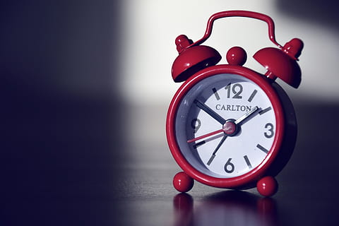 red, carlton alarm clock, alarm clock, macro, time, clock, indoors, accuracy, single object, close-up, no people, studio shot, clock face, number, still life, retro styled, table, focus on foreground, minute hand, shape, circle, 5K, CC0, public domain, royalty free