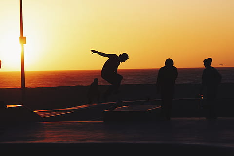 sunset, dusk, sky, summer, skateboarding, skateboard, skateboarders, people, silhouette, shadow, beach, ocean, sea, horizon, friends, group, water, real people, beauty in nature, scenics - nature, orange color, men, horizon over water, leisure activity, lifestyles, nature, group of people, standing, outdoors, 5K, CC0, public domain, royalty free