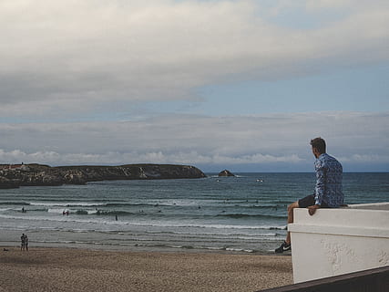 man, wearing, blue, gray, long-sleeved, shirt, sitting, white, concrete, wall, balcony, beach, clouds, daylight, deck, landscape, ocean, sand, sea, seascape, seashore, sightseeing, sky, swimming, water, waves, land, cloud - sky, scenics - nature, beauty in nature, nature, leisure activity, vacations, one person, trip, rear view, holiday, real people, lifestyles, outdoors, looking at view, 2K, CC0, public domain, royalty free