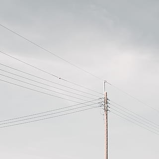 brown utility post, cable, power lines, electric transmission tower, utility pole, smoke, promontory, building, cottage, housing, house, parliament, triangle, slope, nature, fog, harness, power plant, tarmac, asphalt, crow, connection, electricity, technology, fuel and power generation, power line, low angle view, no people, power supply, sky, electricity pylon, telephone line, copy space, day, outdoors, cloud - sky, communication, parallel, environment, above, electrical equipment, 2K, CC0, public domain, royalty free