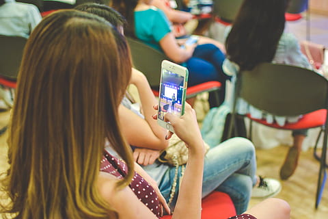 stolen, iphone, captured, wireless technology, technology, mobile phone, sitting, women, communication, smart phone, connection, group of people, portable information device, holding, adult, lifestyles, focus on foreground, long hair, people, casual clothing, real people, using phone, hair, hairstyle, outdoors, 5K, CC0, public domain, royalty free