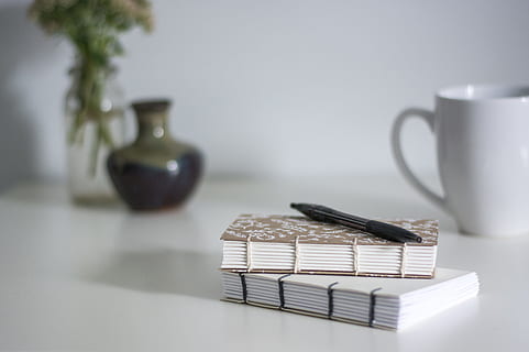 notebook diary, table, stack, indoors, no people, studio shot, cup, group of objects, mug, business, copy space, still life, communication, focus on foreground, food and drink, container, finance, technology, wireless technology, desk, connection, 4K, CC0, public domain, royalty free