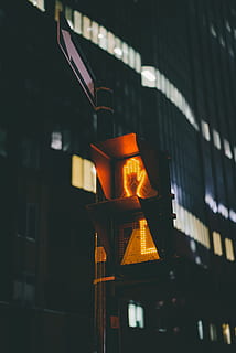 stoplight, dark, night, urban, city, light, hand, sign, post, illuminated, focus on foreground, built structure, architecture, building exterior, no people, glowing, nature, lighting equipment, orange color, building, close-up, outdoors, heat - temperature, low angle view, flame, art and craft, technology, melting, 5K, CC0, public domain, royalty free