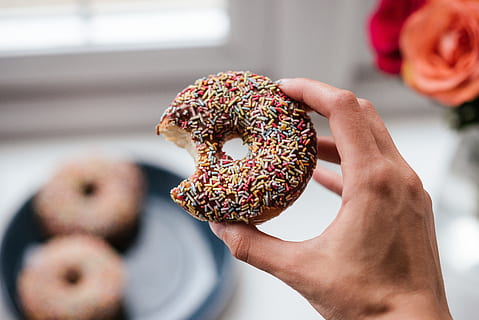 person, holding, doughnut, sprinkles, bite, breakfast, cake, candy, chocolate, delicious, dessert, donuts, doughnuts, food, homemade, indoors, pastry, sugar, sweets, treats, food and drink, sweet food, baked, donut, sweet, adult, focus on foreground, one person, indulgence, freshness, hand, close-up, men, human body part, snack, temptation, 5K, CC0, public domain, royalty free