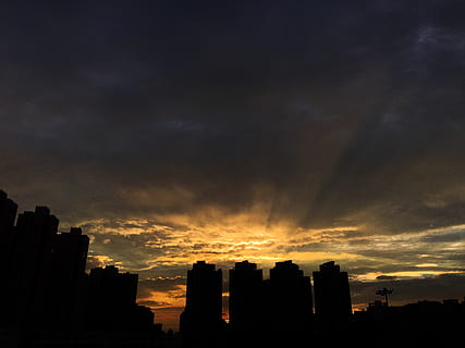 sunset, before the typhoon, sky, building exterior, architecture, built structure, cloud - sky, building, silhouette, city, no people, nature, cityscape, residential district, orange color, dramatic sky, urban skyline, outdoors, office building exterior, skyscraper, beauty in nature, 4K, CC0, public domain, royalty free