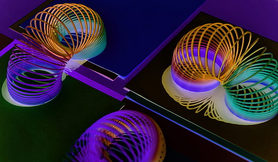 three, multicolored, plastic, learning, toys, background, close-up, coil, colored, colorful, colors, design, flexible, invert, objects, pattern, round out, shape, spiral, stretch, indoors, studio shot, no people, motion, purple, black background, illuminated, blurred motion, multi colored, long exposure, ball, sphere, sport, blue, technology, spinning, arts culture and entertainment, light - natural phenomenon, nightlife, 1080P, CC0, public domain, royalty free