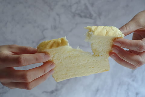 person, holding, slice, loaf bread, baked, bread, hand, loaf, nutrition, pastry, sweet, tasty, toast, wheat, human hand, human body part, food and drink, one person, food, close-up, freshness, indoors, snack, ready-to-eat, focus on foreground, body part, adult, women, unrecognizable person, nacho chip, finger, 5K, CC0, public domain, royalty free