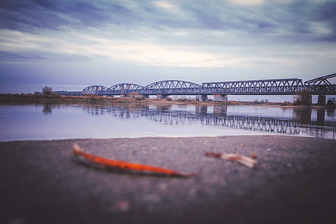 tilt photography, metal bridge, architecture, bridge, river, bridge - man made structure, connection, water, transportation, built structure, sky, nature, city, cloud - sky, no people, travel destinations, outdoors, building exterior, dusk, arch bridge, 2K, CC0, public domain, royalty free