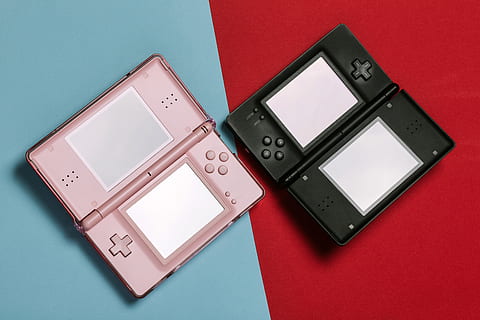 pink, black, nintendo ds, computer, console, design, ds, electronics, gaming, nintendo, screen, technology, indoors, studio shot, communication, colored background, wireless technology, connection, no people, red, smart phone, portable information device, red background, digital tablet, table, group of objects, high angle view, still life, industry, electrical equipment, blue background, 5K, CC0, public domain, royalty free