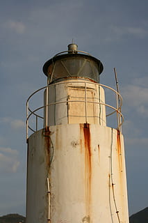 lighthouse, tower, water tower, control tower, sky, cloud - sky, architecture, built structure, nature, no people, low angle view, storage tank, building exterior, outdoors, day, factory, industry, water tower - storage tank, metal, old, sunlight, safety, rusty, security, industrial equipment, water conservation, 4K, CC0, public domain, royalty free