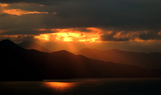 mountain, sunset photograph, clouds, mountains, reflection, sky, sun, sunrise, sunset, water, cloud - sky, beauty in nature, scenics - nature, nature, tranquility, lake, mountain range, no people, tranquil scene, dramatic sky, idyllic, environment, orange color, silhouette, outdoors, dark, ominous, romantic sky, 4K, CC0, public domain, royalty free