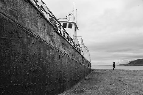 ship on dock, abandoned, beach, black and white, clouds, daylight, environment, landscape, mountain, nature, nature photography, ocean, person, photography, sand, scenic, sea, seashore, ship, ship wreck, sky, transportation system, water, watercraft, transportation, cloud - sky, architecture, day, one person, real people, wall, mode of transportation, lifestyles, built structure, land, outdoors, 2K, CC0, public domain, royalty free