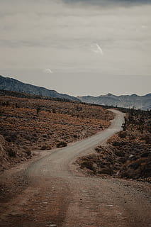 empty, pathway, brown, grass, sky, cloud - sky, road, environment, scenics - nature, the way forward, landscape, tranquil scene, tranquility, direction, mountain, beauty in nature, nature, transportation, no people, dirt road, non-urban scene, dirt, day, outdoors, climate, arid climate, long, 5K, CC0, public domain, royalty free