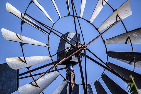 closeup of windmill, wind, blue, mill, windmill, sky, renewable, energy, farm, alternative, tower, rural, pump, old, water, power, blades, up close, workings, low angle view, technology, renewable energy, fuel and power generation, no people, clear sky, turbine, wind turbine, architecture, wind power, alternative energy, nature, day, built structure, environmental conservation, outdoors, connection, metal, directly below, electrical equipment, 4K