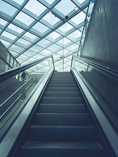 low, angle photography, escalator, building, ceiling, perspective, architecture, staircase, railing, steps and staircases, transportation, indoors, built structure, modern, convenience, direction, low angle view, the way forward, no people, glass - material, day, empty, futuristic, airport, on the move, moving walkway, 4K, CC0, public domain, royalty free