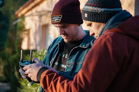 two, men, using, black, device, person, human, apparel, clothing, hat, camera, beanie, cap, filmproduction, filming, camera equipment, cameragear, videoproduction, drone, finger, electronics, pc, computer, photo, photography, two people, togetherness, knit hat, adult, young men, portrait, headshot, side view, males, warm clothing, young adult, day, alcohol, holding, nature, positive emotion, outdoors, couple - relationship, scarf, 5K, CC0, public domain, royalty free