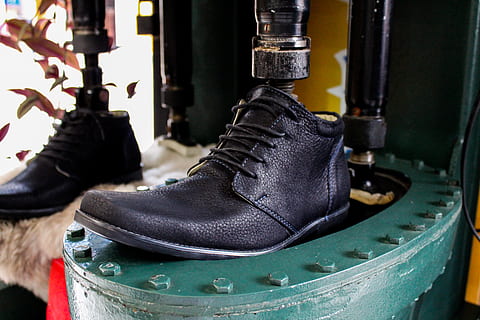 ecuador, cotacachi, shoe, no people, close-up, focus on foreground, indoors, black color, boot, day, clothing, personal accessory, still life, leather, metal, pair, hanging, absence, retail display, store, wood - material, 5K, CC0, public domain, royalty free