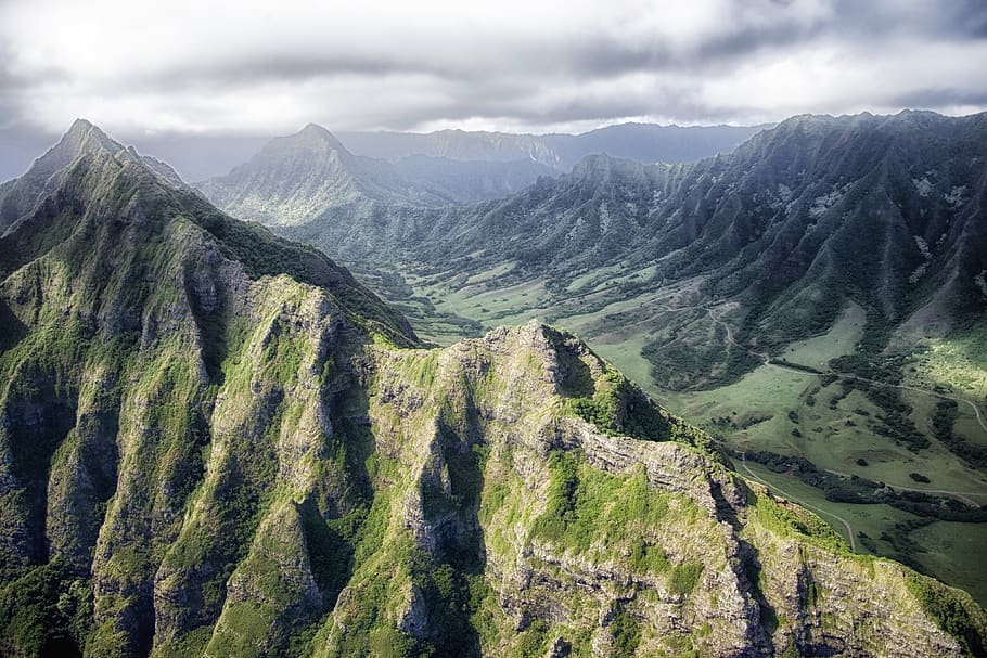 high, rise mountain overview, clouds, mountain range, mountains, nature, scenic, sky, valley, mountain, scenics - nature, environment, beauty in nature, landscape, cloud - sky, tranquil scene, tranquility, plant, green color, no people, travel destinations, land, non-urban scene, day, pine tree, coniferous tree, outdoors, pine woodland, mountain ridge, mountain peak, 4K