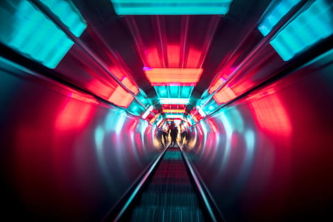 people, walking, escalator, going, light, escelator, architecture, illuminated, indoors, lighting equipment, direction, transportation, the way forward, motion, red, adult, built structure, tunnel, subway station, connection, incidental people, diminishing perspective, vanishing point, subway, 5K, CC0, public domain, royalty free