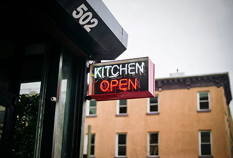 kitchen, open, sign, restaurant, food, dine, text, architecture, building exterior, communication, western script, built structure, low angle view, city, no people, day, window, building, capital letter, outdoors, illuminated, information, red, commercial sign, focus on foreground, 4K, CC0, public domain, royalty free