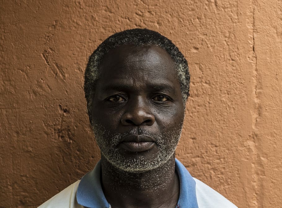 men, blue, white, collared, top, portrait, headshot, one person, front view, wall - building feature, looking at camera, real people, lifestyles, close-up, males, leisure activity, day, adult, mid adult, architecture, beard, young men, mature men, brick, human face, 4K