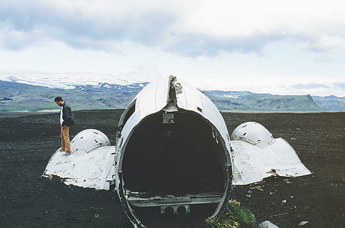 airplane, crash, wreck, damange, dirt, man, mountains, hills, valleys, snow, peaks, sky, clouds, cloud - sky, mountain, nature, one person, day, real people, standing, men, leisure activity, full length, beauty in nature, outdoors, environment, air vehicle, scenics - nature, lifestyles, snowcapped mountain, 2K, CC0, public domain, royalty free