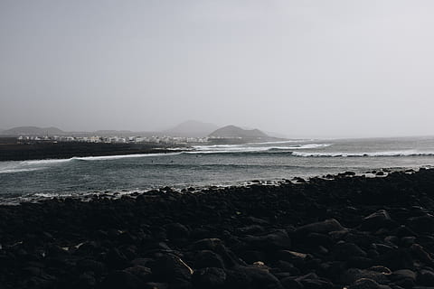 seashore beside mountain, beach, clouds, cold, dawn, fog, horizon, landscape, long exposure, mountains, nature, ocean, rock, rocky, sea, seascape, seashore, sky, water, waves, beauty in nature, scenics - nature, land, solid, tranquil scene, rock - object, tranquility, day, no people, idyllic, mountain, copy space, non-urban scene, outdoors, horizon over water, pebble, rocky coastline, 4K, CC0, public domain, royalty free