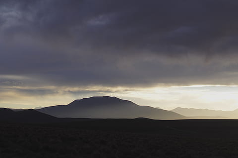 mountain under clouds, mountain, cloud, bolivia, mountain range, nature, outdoors, landscape, sky, weather, yellow, sunset, sunrise, purple, cloudy, storm, sunlight, hill, countryside, cumulus, plateau, scenics - nature, tranquil scene, cloud - sky, tranquility, beauty in nature, silhouette, environment, non-urban scene, no people, idyllic, land, remote, 4K, CC0, public domain, royalty free