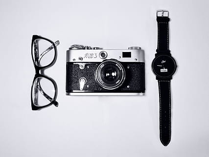 eyeglasses, camera, watch, objects, accessories, technology, studio shot, indoors, retro styled, white background, still life, photography themes, single object, close-up, no people, camera - photographic equipment, communication, nostalgia, antique, text, number, lens - optical instrument, analog, equipment, 2K, CC0, public domain, royalty free