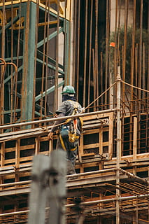 man, construction site, architecture, builder, building, construction, construction worker, person, site, work, worker, working, industry, occupation, construction industry, headwear, protective workwear, incomplete, hat, helmet, day, built structure, one person, hardhat, metal, protection, 5K