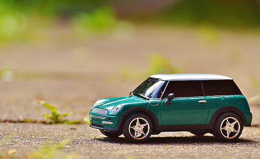 green, scale model car, brown, pavement, car, macro, Mini Cooper, miniature, toy car, vehicle, mode of transportation, motor vehicle, transportation, retro styled, toy, land vehicle, vintage car, childhood, focus on foreground, day, road, green color, nature, outdoors, driving, selective focus, small, wheel, 4K, CC0, public domain, royalty free