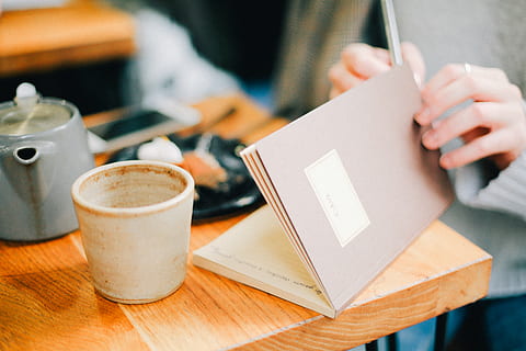 woman, holding, brown, open, notebook, coffee, composition, container, cup, desk, drink, food, hands, indoors, office, tea, teapot, wooden, work, workplace, workspace, food and drink, one person, coffee - drink, selective focus, mug, human hand, table, close-up, focus on foreground, hand, wood - material, human body part, coffee cup, adult, cafe, 5K, CC0, public domain, royalty free