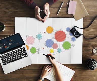 woman, drawing, colorful, circles, camera, coffee, composition, data, desk, diagram, direction, document, electronics, hands, indoors, internet, laptop, notebook, office, paperwork, pen, room, technology, top view, wooden table, work, working, workplace, workspace, table, real people, human hand, human body part, one person, high angle view, wood - material, directly above, hand, adult, computer, lifestyles, women, paper, communication, holding, wireless technology, multi colored, finger, body part, using laptop, 4K, CC0, public domain, royalty free