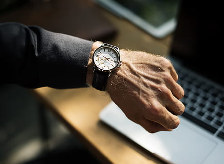 person, wearing, round, black, analog, watch, adult, Analogue, break, focus, hand, indoors, laptop, late, man, technology, time, working, wristwatch, human hand, one person, human body part, clock, men, occupation, business person, selective focus, close-up, businessman, business, checking the time, finger, 5K