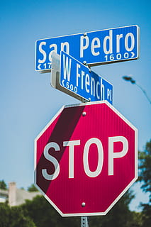 san pedro signage, clouds, daytime, directions, guidance, information, signage, signpost, signs, sky, stop, symbol, warning, communication, sign, western script, text, road sign, road, information sign, no people, blue, day, capital letter, warning sign, red, low angle view, nature, stop sign, close-up, 5K, CC0, public domain, royalty free