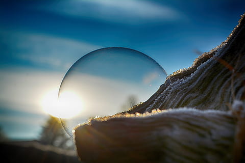 soap bubble, sun, tree, log, portrait, close up, blue sky, sunrise, colorful, winter, ice, wintertime, cold, beautiful, fantastic, sky, nature, close-up, sunlight, selective focus, cold temperature, beauty in nature, outdoors, no people, snow, day, lens flare, cloud - sky, plant, frozen, blue, tranquility, 5K, CC0, public domain, royalty free