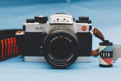 leica slr camera, aperture, camera, classic, electronics, equipment, lens, photography themes, camera - photographic equipment, photographic equipment, technology, no people, focus on foreground, lens - optical instrument, close-up, digital camera, number, text, still life, blue, indoors, black color, retro styled, selective focus, photographing, blue background, slr camera, 5K, CC0, public domain, royalty free