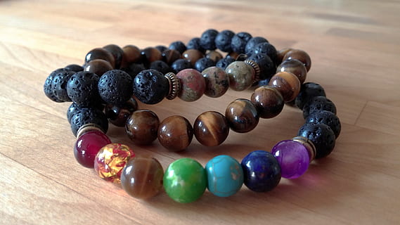 bracelet, chakra, bangle, agate, jasper, jewelry, gemstone, beads, gems, accessory, wood - material, table, bead, indoors, close-up, still life, no people, necklace, large group of objects, multi colored, focus on foreground, food, fashion, black color, personal accessory, berry fruit, healthy eating, fruit, luxury, 4K, CC0, public domain, royalty free
