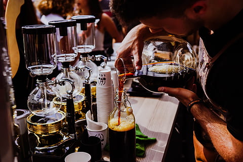 drinks, beverage, cold, table, restaurant, coffee, glass, counter, people, man, cups, food and drink, drink, refreshment, real people, alcohol, food, indoors, hand, holding, focus on foreground, business, freshness, human hand, men, drinking glass, lifestyles, one person, bar counter, bartender, 5K, CC0, public domain, royalty free