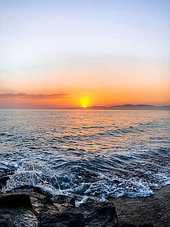 seashore during sunset, los angeles, coast, ocean, sea, water, united states, beach, outdoors, nature, shore, sea waves, sunrise, sunset, blue, wave, orange, soil, rock, sun, waves, sky, scenics - nature, beauty in nature, horizon over water, orange color, motion, horizon, tranquility, tranquil scene, no people, idyllic, cloud - sky, breaking, 5K, CC0, public domain, royalty free