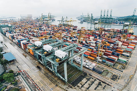 container, van, export, travel, cargo, wharf, block, transportation, architecture, water, high angle view, cargo container, freight transportation, shipping, city, crane - construction machinery, machinery, building exterior, industry, mode of transportation, pier, nature, business, day, commercial dock, built structure, no people, outdoors, cityscape, industrial district, 4K