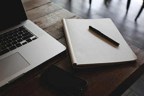 macbook, laptop, computer, table, notepad, graph paper, pen, technology, business, wireless technology, communication, connection, still life, indoors, no people, wood - material, high angle view, furniture, paper, desk, writing instrument, publication, portable information device, book, keyboard, blank, 5K, CC0, public domain, royalty free