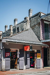 gray shop front, machine, roof, door, wheel, tile roof, spoke, alloy wheel, pump, gas station, vending machine, car wheel, tire, kiosk, gas pump, shelf, cash machine, atm, patio, motor, window, architecture, building exterior, built structure, sky, nature, day, building, no people, sunlight, text, city, communication, outdoors, western script, blue, store, clear sky, entrance, business, street, 4K, CC0, public domain, royalty free