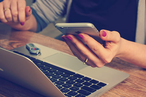 technology, work, laptop, apple, iphone, office, wireless technology, communication, human hand, computer, connection, hand, indoors, adult, human body part, portable information device, using laptop, close-up, table, women, people, internet, typing, keyboard, buying, 4K, CC0, public domain, royalty free