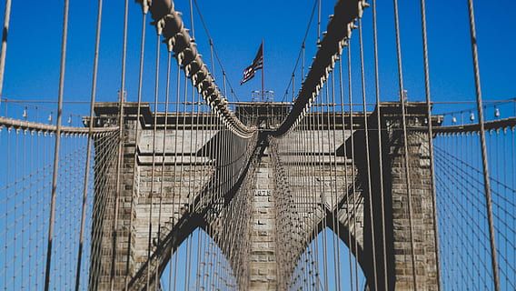 gray, bridge, daytime, manhattan, symmetry, symmetric, symmetrical, clear sky, new york city, new york, flag, cable, line, brick, brooklyn, brooklyn bridge, sky, built structure, architecture, connection, bridge - man made structure, suspension bridge, blue, low angle view, transportation, nature, engineering, travel destinations, travel, rope, tourism, day, sailboat, outdoors, rigging, 5K, CC0, public domain, royalty free